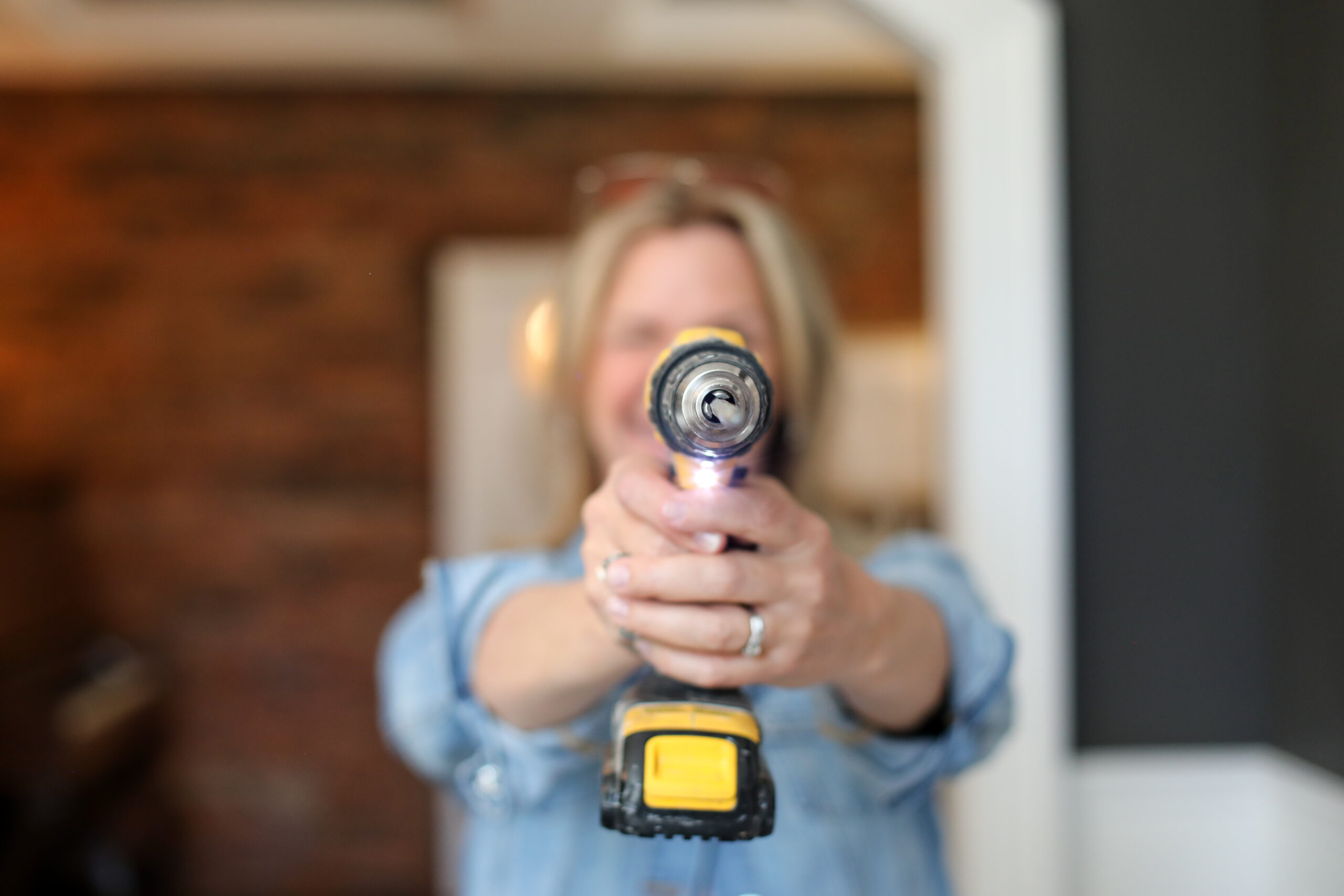 woman holding a power drill